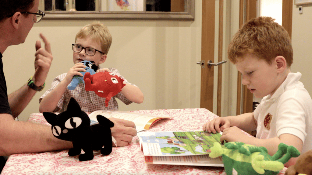 Parent and children using Monster Phonics at home