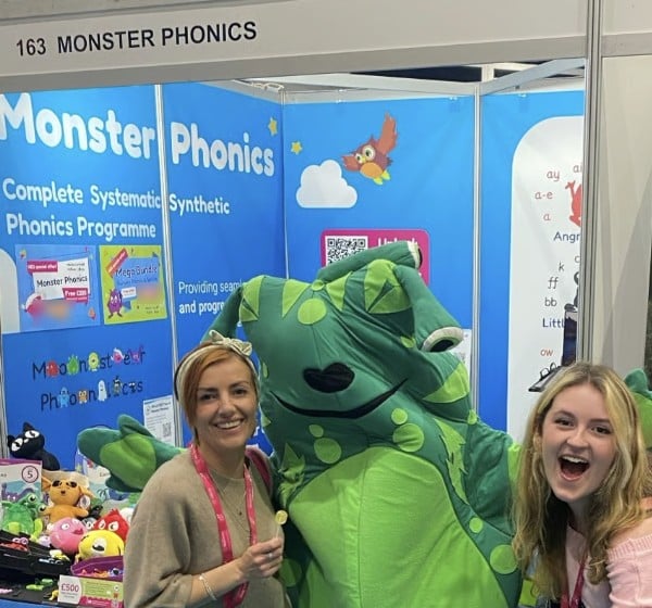 Visitors meeting Green Froggy at the Monster Phonics stand at the National Education Show in Cardiff